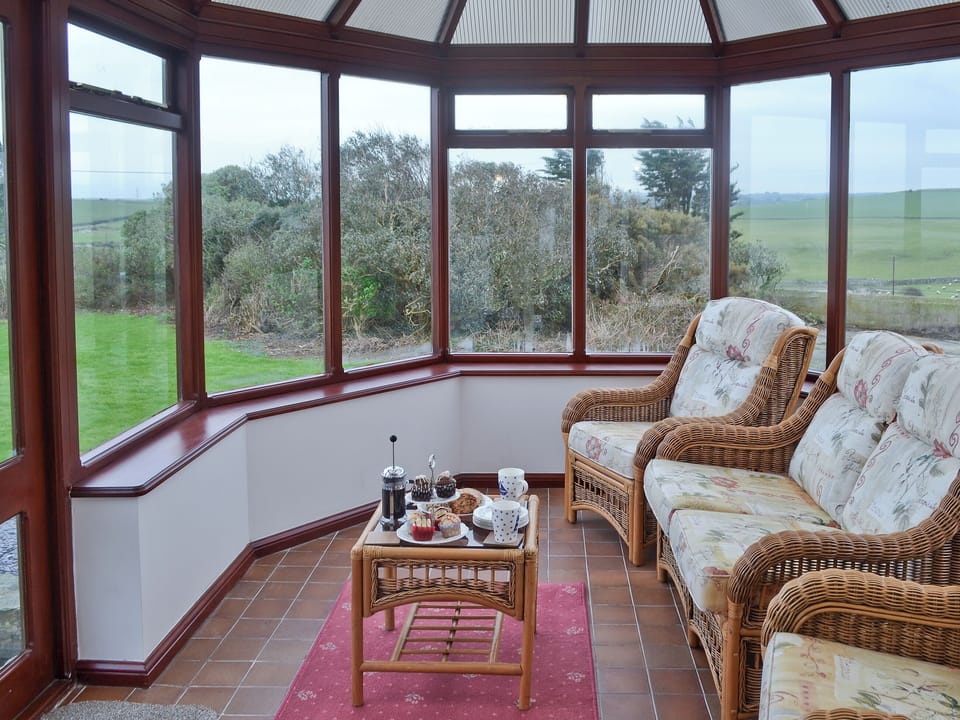 Conservatory overlooking the garden | Bwthyn Pereos, Cemlyn near Amlwch