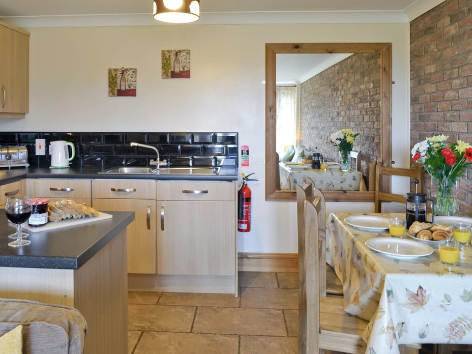 Comprehensively-equipped kitchen and dining area | Bevan Cottage - Filey Holiday Cottages, Filey