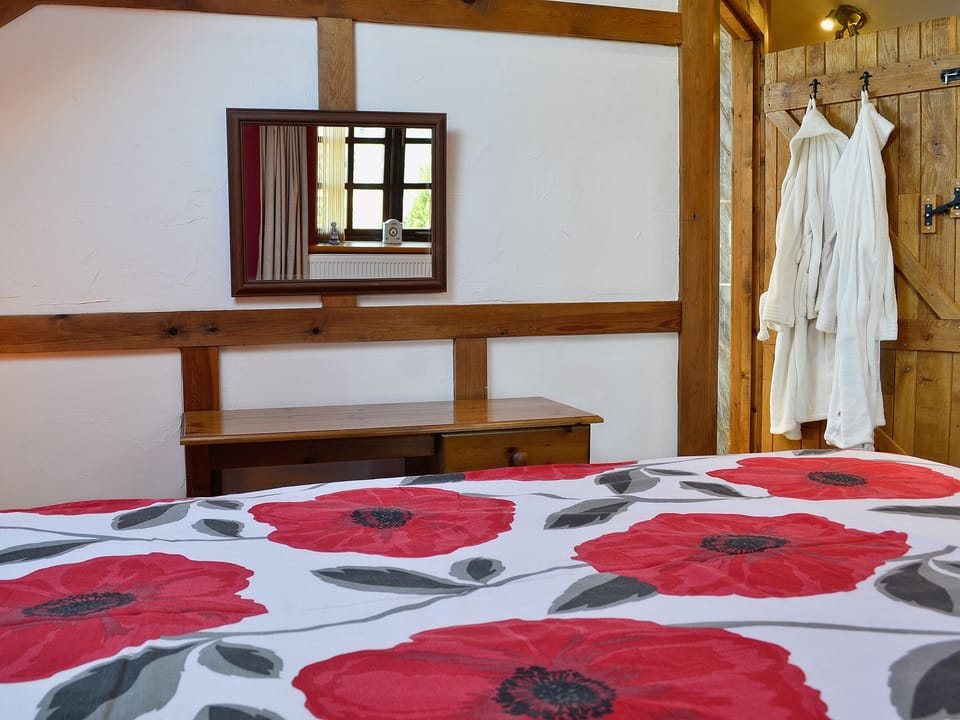 Charming double bedroom | The Coach House at Old Vicarage Cottage, Betws-yn-Rhos, near Abergele