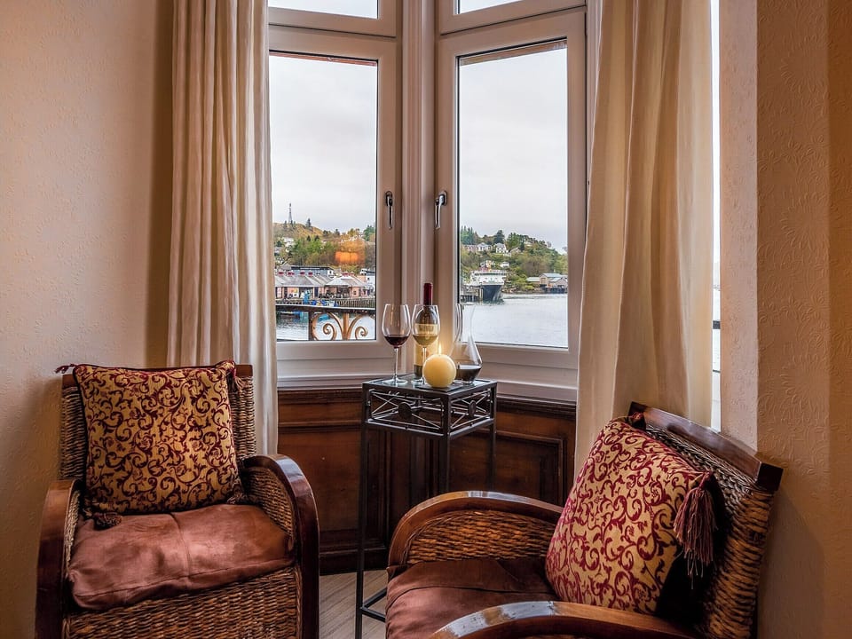 Cosy seating area in the double bedroom | Captain&rsquo;s Folly, Oban