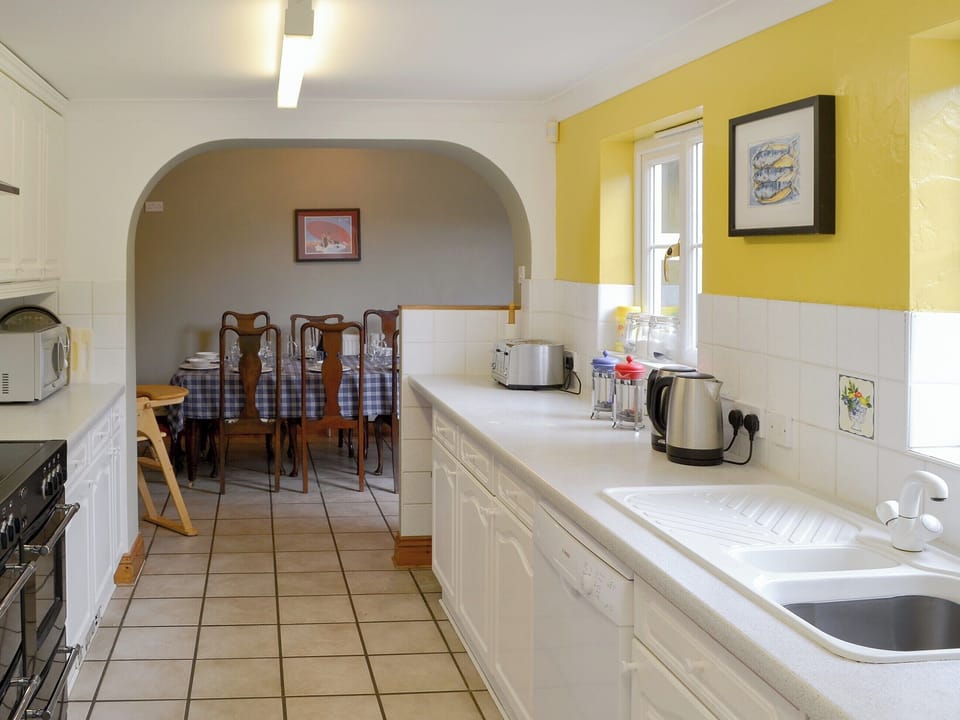 Spacious kitchen leading into dining area | Pembroke House, Happisburgh