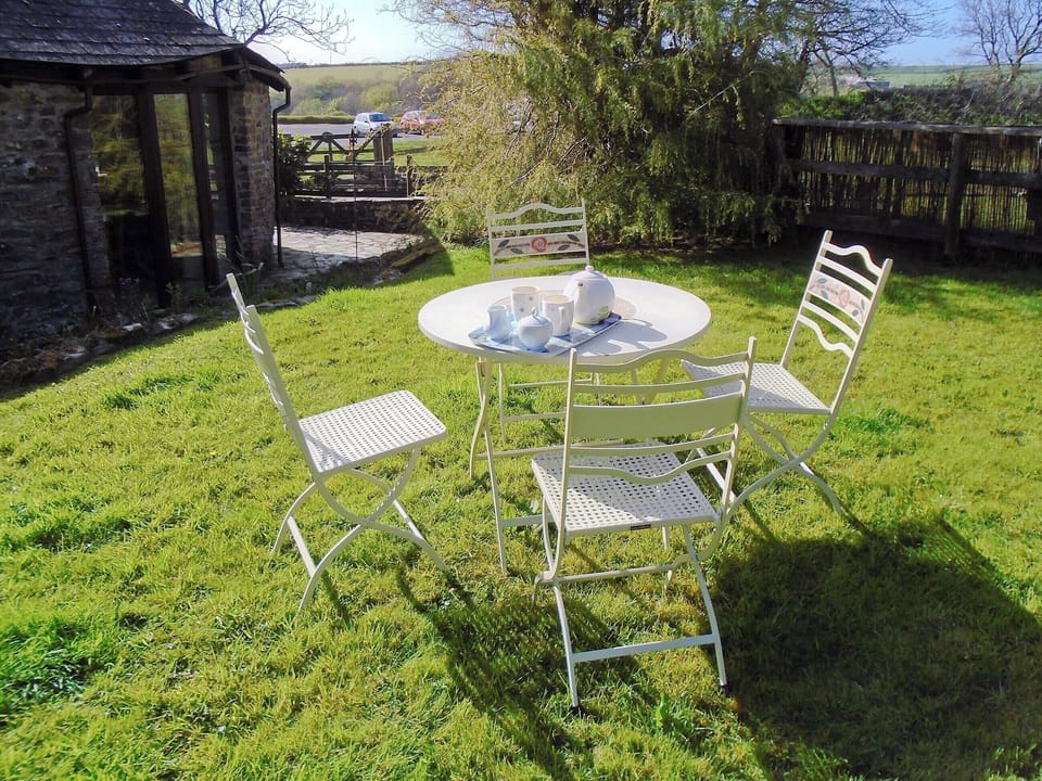 Sitting out area in the rear garden | Oak Cottage, Woolsery, near Bideford