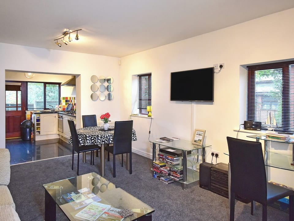 Modest dining area and through kitchen | South Lodge Cottage, Worthington, near Standish