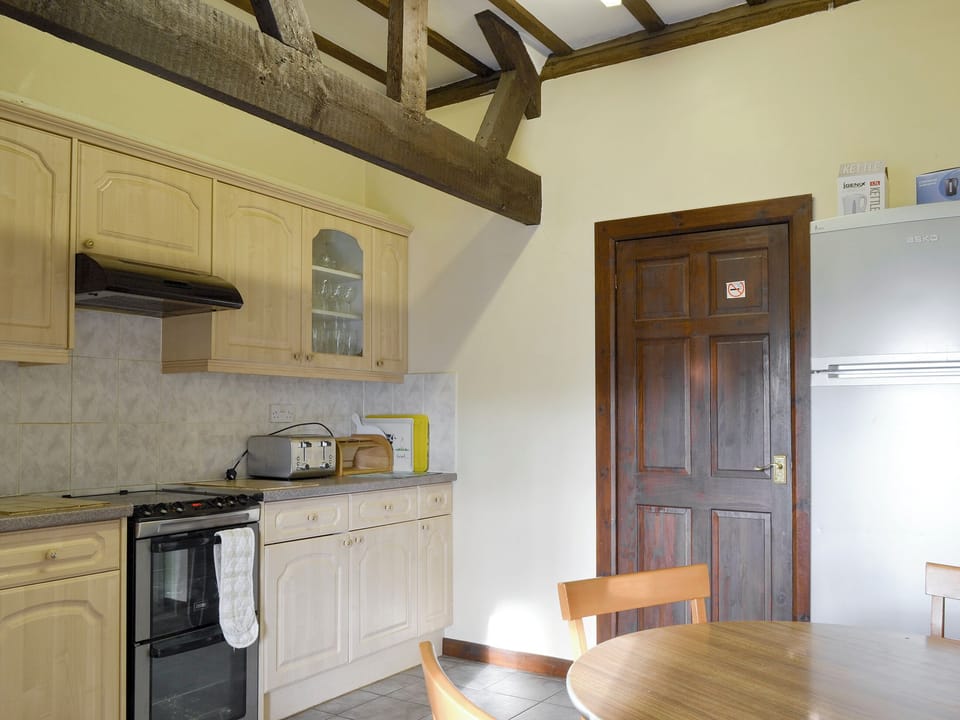Informal dining area within kitchen | Grove Sprightly Barn, Craven Arms