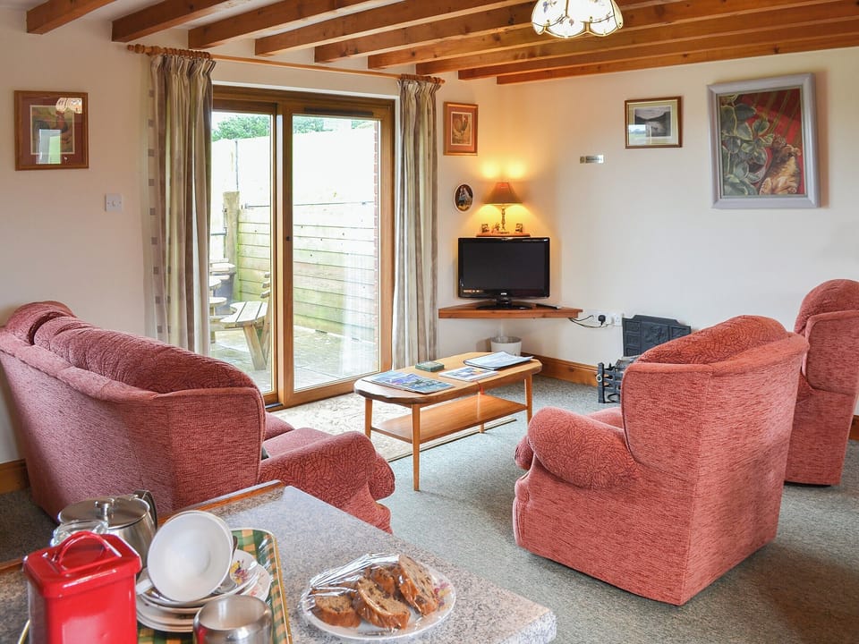 Lovely beamed living area | Merlin View - Higher Lanvean Farm, St Mawgan, near Newquay