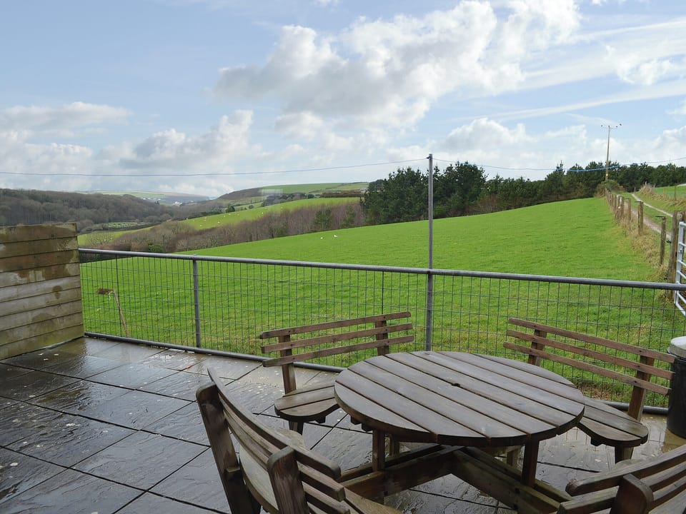 Paved patio area with seating | Merlin View - Higher Lanvean Farm, St Mawgan, near Newquay