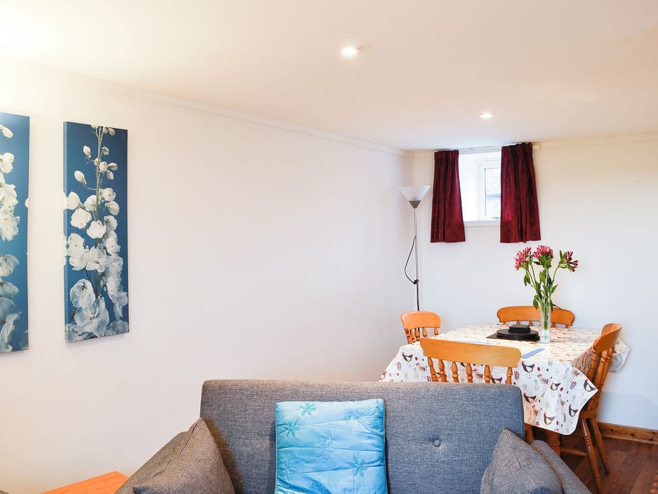 Charming living room with modest dining area | The Hen Hoose, Nether Barr, near Newton Stewart