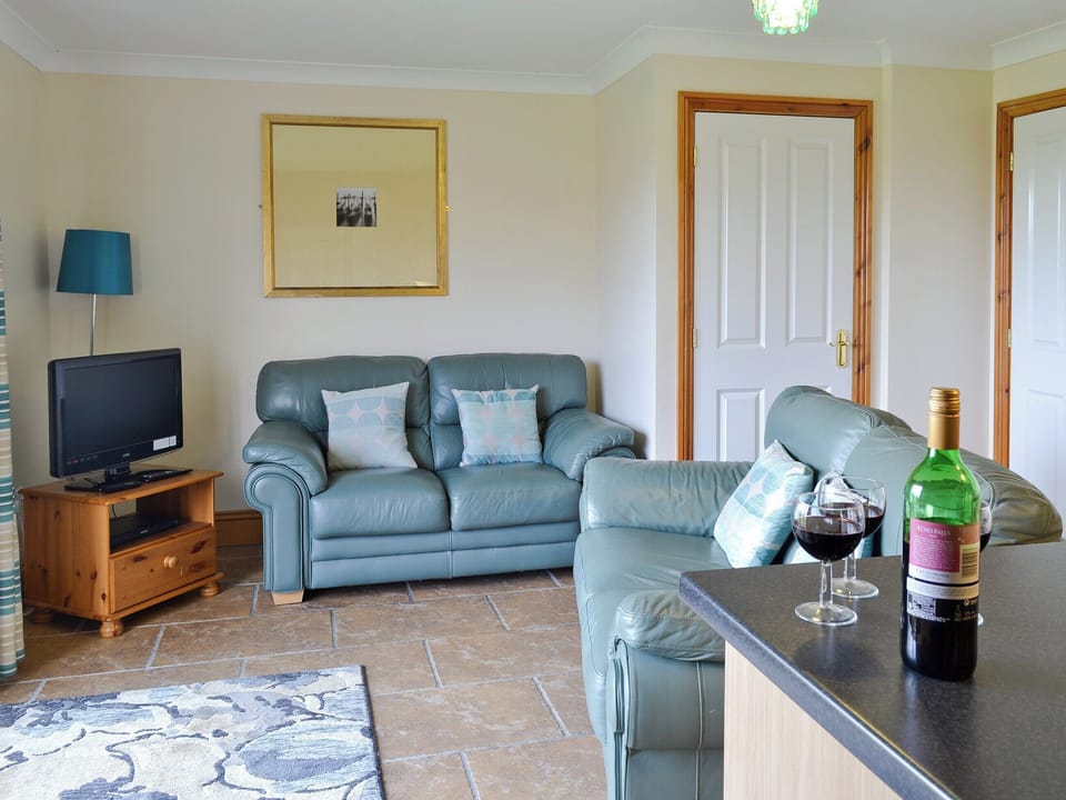 Attractive lounge area of open-plan room | Vaughan Cottage - Filey Holiday Cottages, Filey
