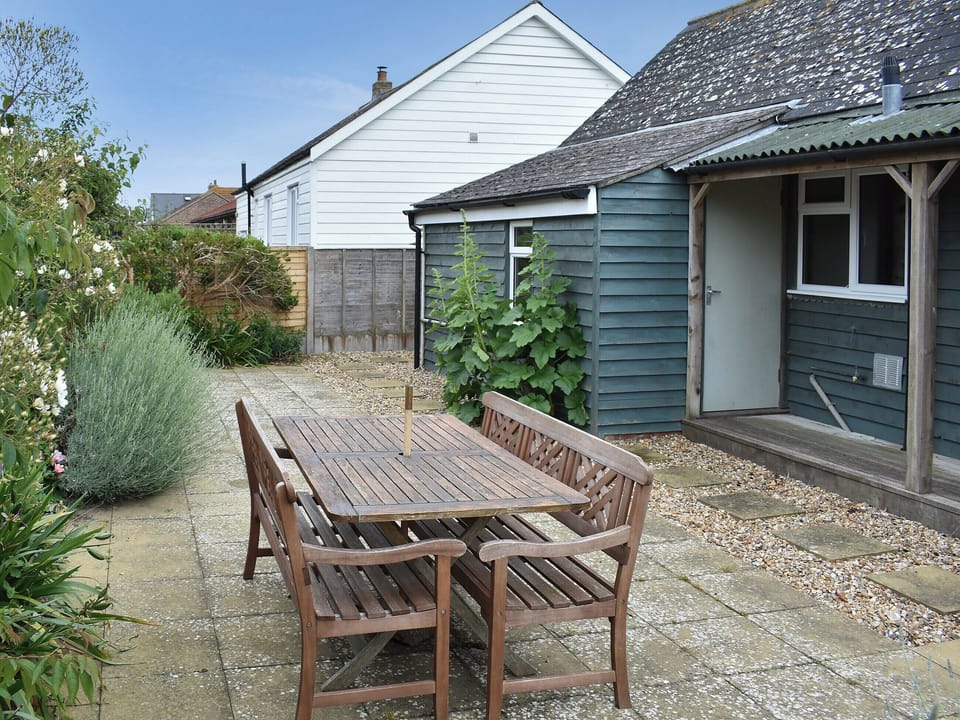 Paved patio area ideal for alfresco entertaining | Cockle Cottage, Elmer, near Middleton on Sea