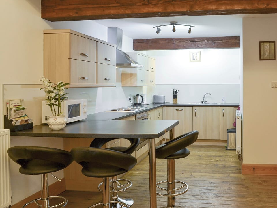 Well-equipped kitchen with dining bar | The Hay Barn - Ash Farm Barns, North Willingham, near Market Rasen