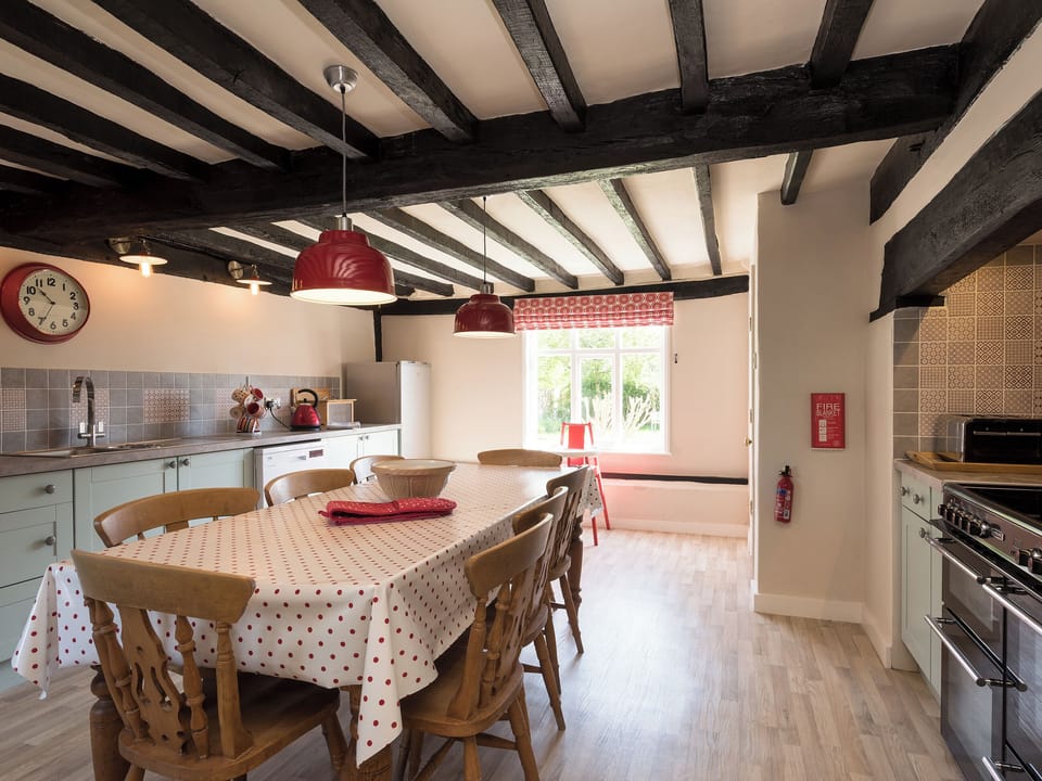 Traditional farmhouse kitchen/dining area with electric range | Cravens Manor, Henham, near Southwold