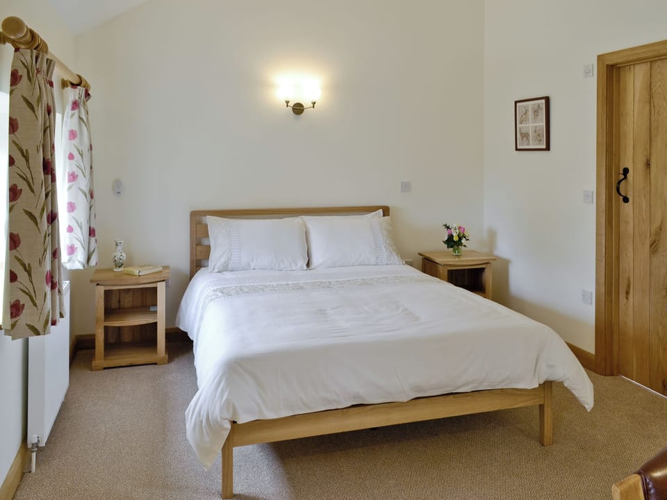 Comfortable master bedroom | Herons&rsquo; Weir - Jeffries Mill Cottages, Spring Gardens, Frome