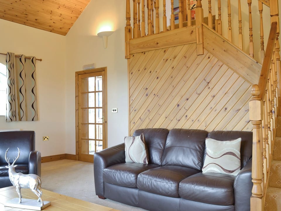 Large light living room, with stair case to upper floor | No 5 Pengraig Draw - Pengraig Cottages, Near Llanfarian