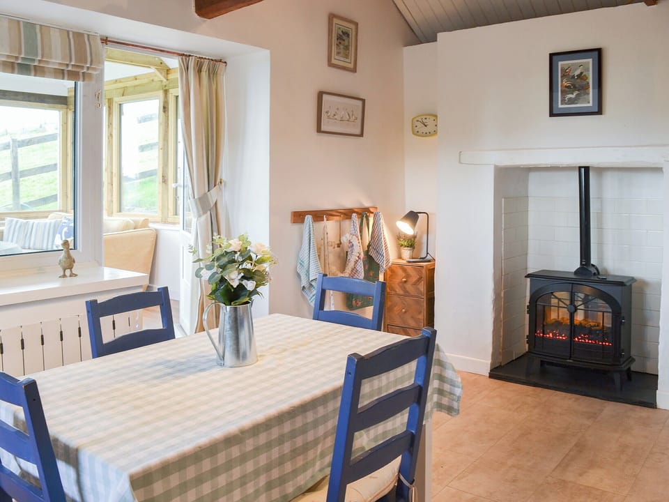 Spacious kitchen/diner with electric &rsquo;woodburner&rsquo; | West Hurscott Cottage, Hurscott, near Barnstaple
