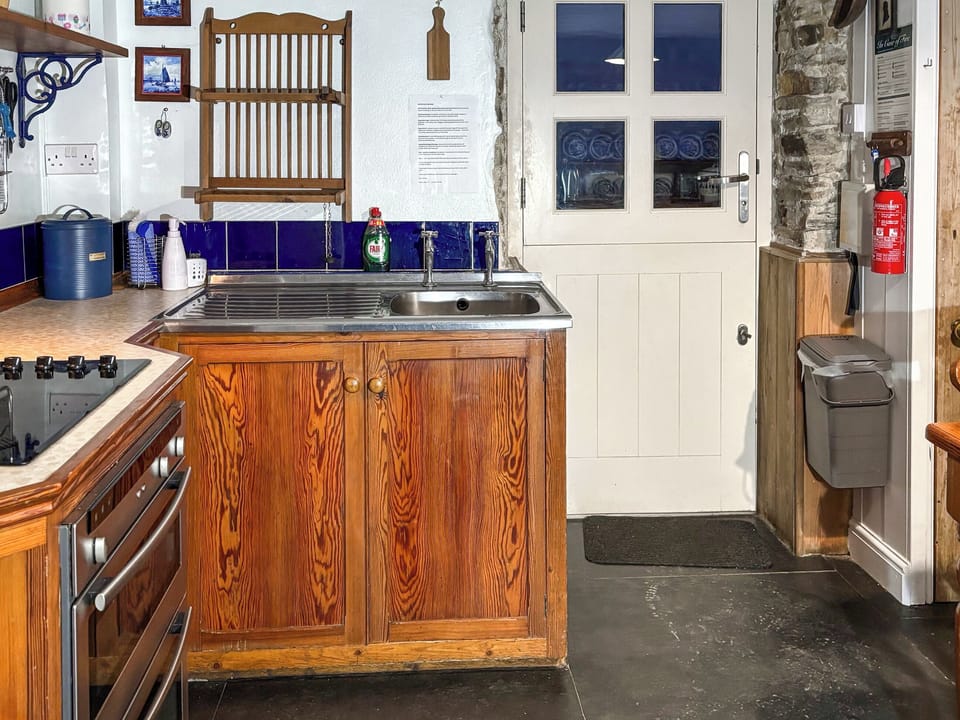 Kitchen with slate floor and stable door | Downhouse Cottage - Downhouse Cottages, Trebarwith, near Delabole