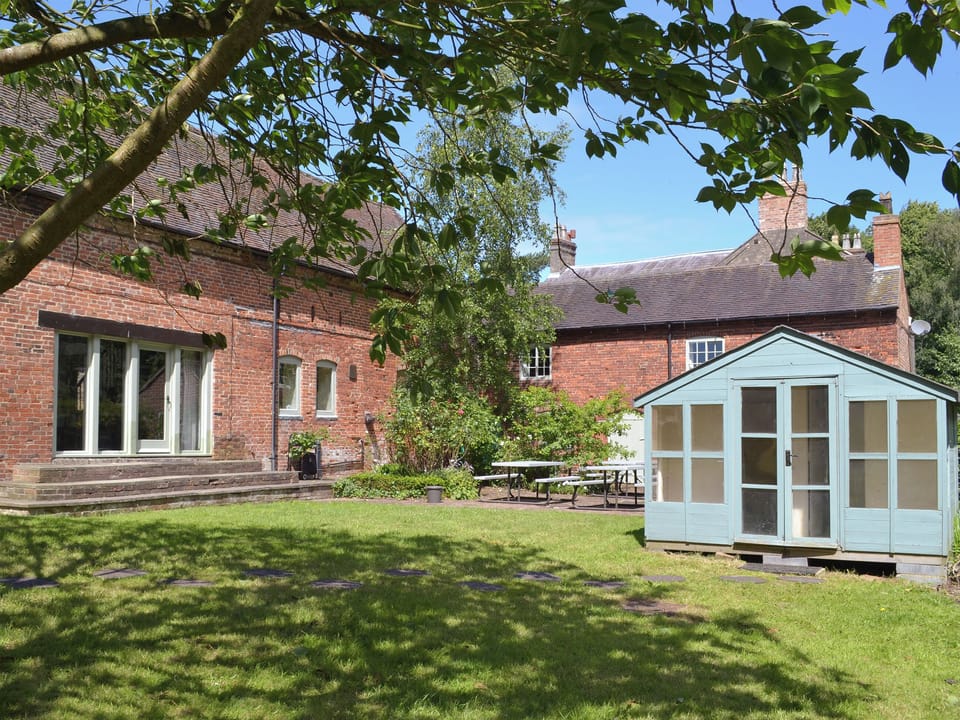 Shared lawned garden with seating and gas BBQ. | Burdett&rsquo;s Cottage, Foremark Threshing Barn, Repton Cottage - Foremark Cottages, Milton, near Repton