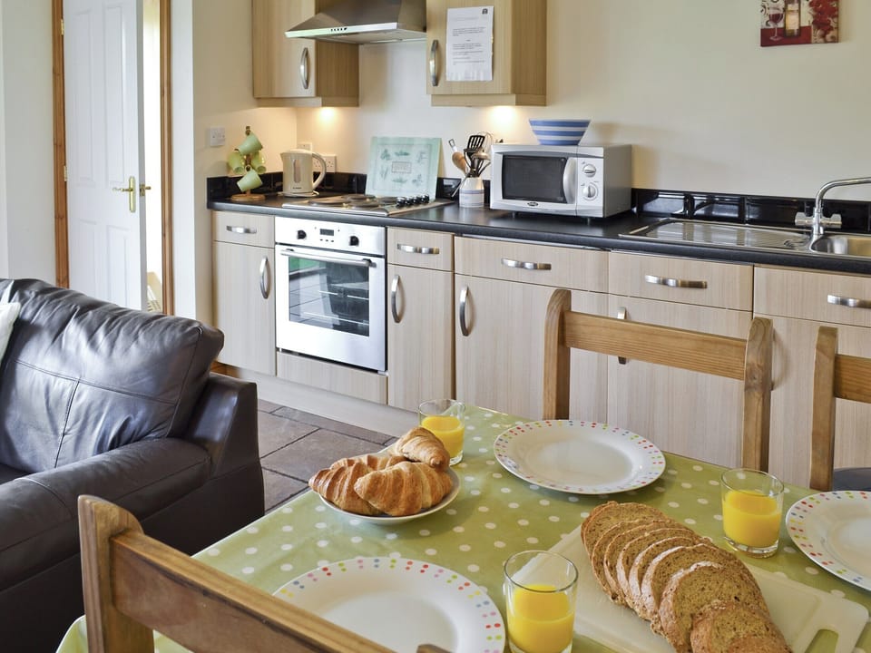 Open plan design incorporates kitchen | Swallow Cottage - Filey Holiday Cottages, Filey