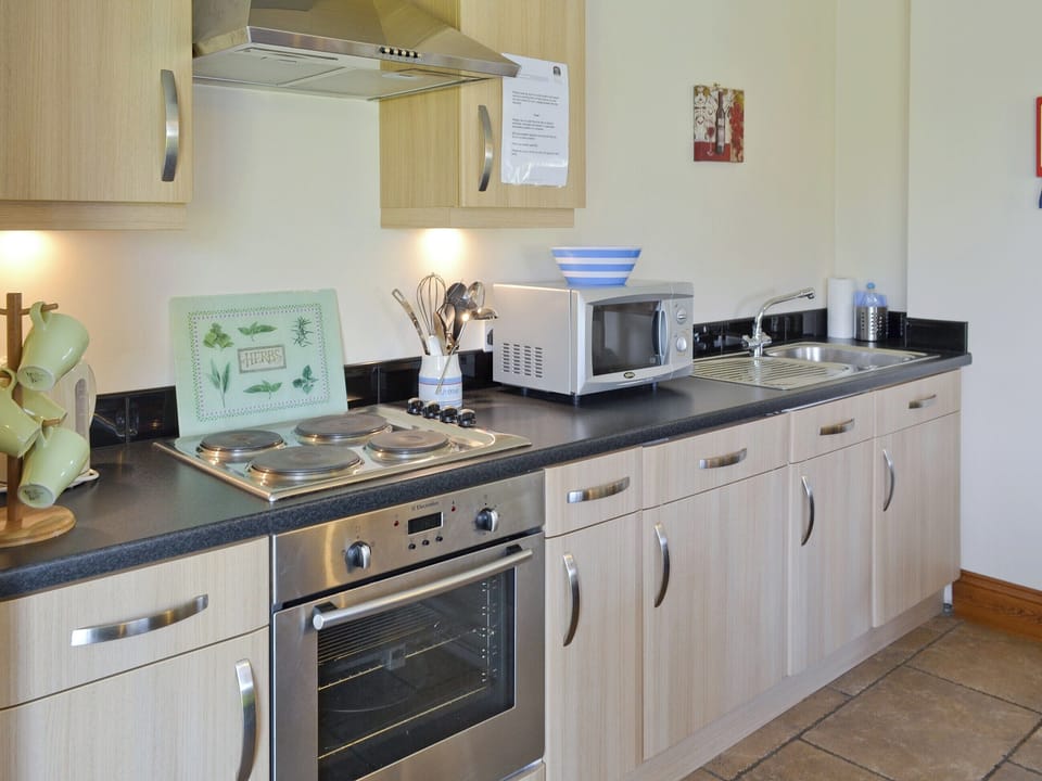 Well-equipped fitted kitchen | Swallow Cottage - Filey Holiday Cottages, Filey