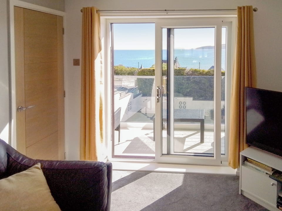 Access to balcony from lounge | Beach Cottage, Benllech