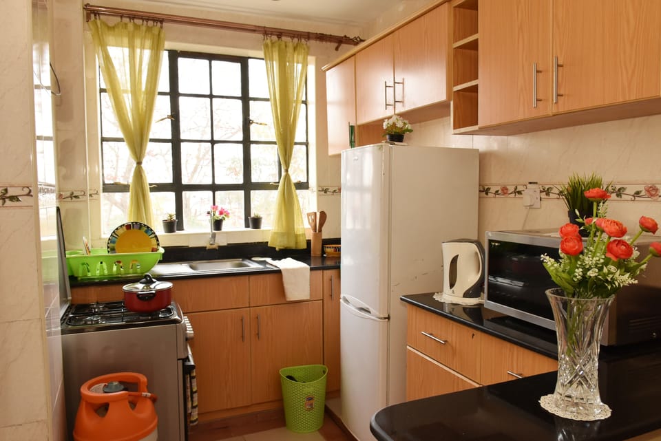 Apartment, 1 Double Bed, Non Smoking | Private kitchen | Full-size fridge, microwave, oven, stovetop