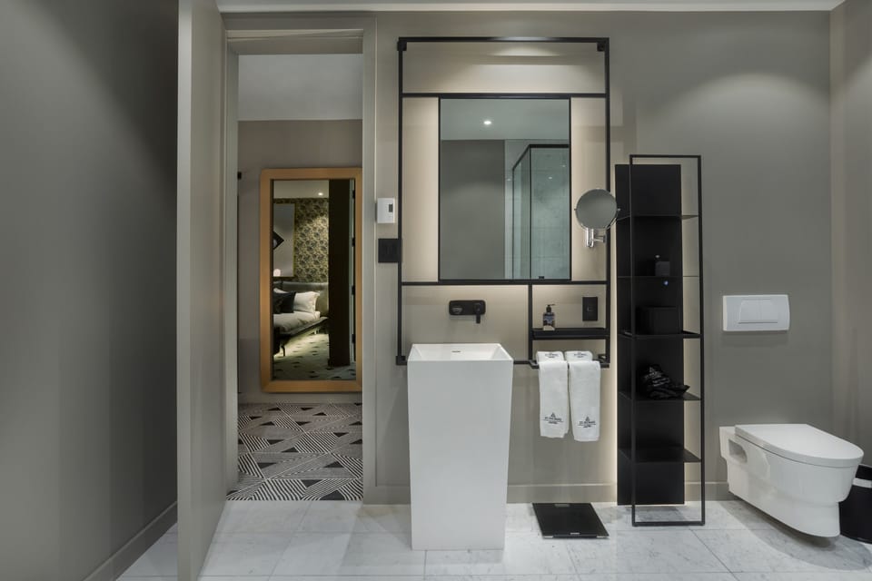 Designer toiletries, hair dryer, bathrobes, slippers