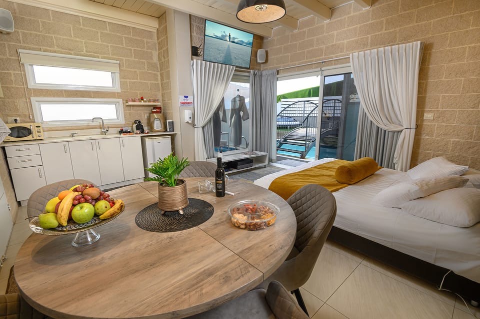 Luxury Suite, Multiple Beds, Non Smoking, Pool View | Premium bedding, free minibar, desk, laptop workspace