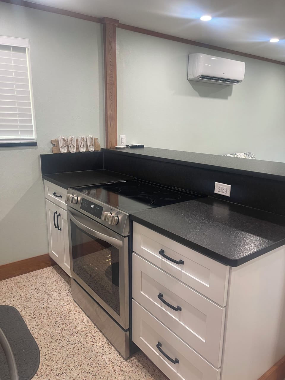 BEACH COTTAGE CHEF’S KITCHEN—FRIGIDAIRE RANGE, SHAKER CABINETS, BLACK GRANITE