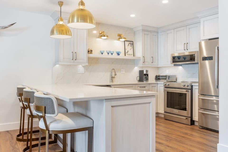 Bright, modern kitchen with cozy breakfast bar seating
