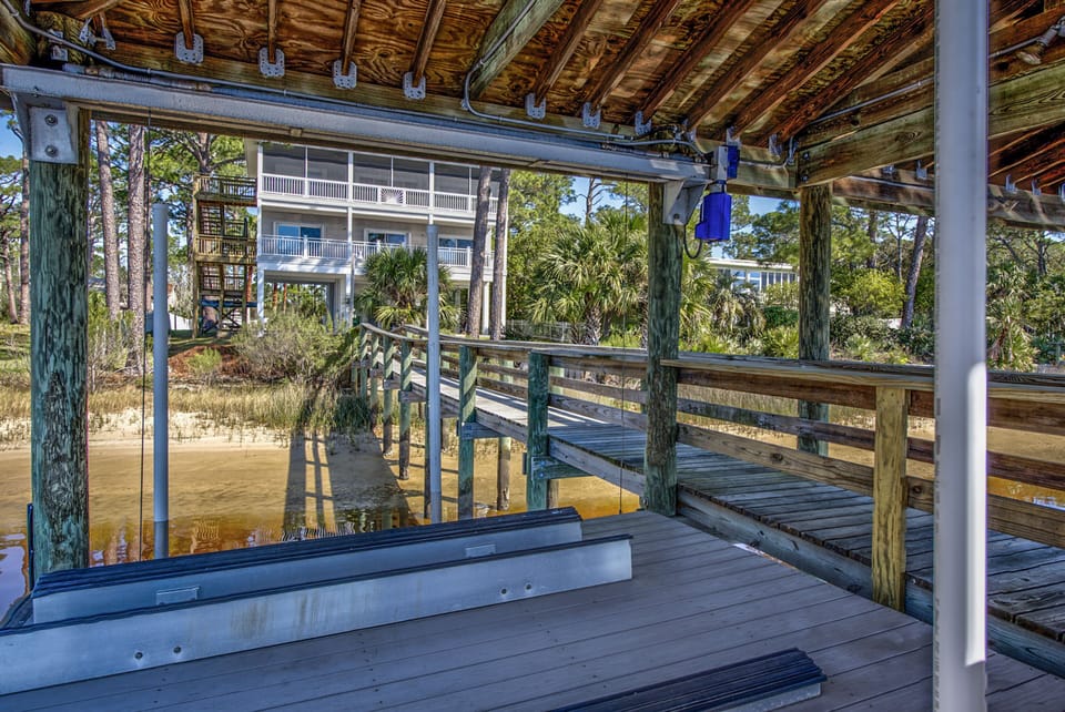 Boat dock, shows jet ski lift, which is only used to get down to your tied boat