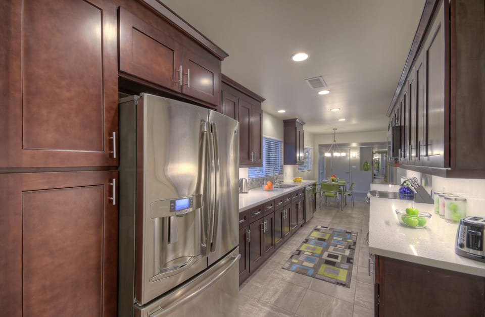 Beautiful designer kitchen is completely stocked so preparing and serving your favorite cuisine is a breeze.