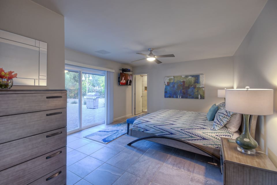 The east primary suite is one of two primary suites with king beds, and TVs.