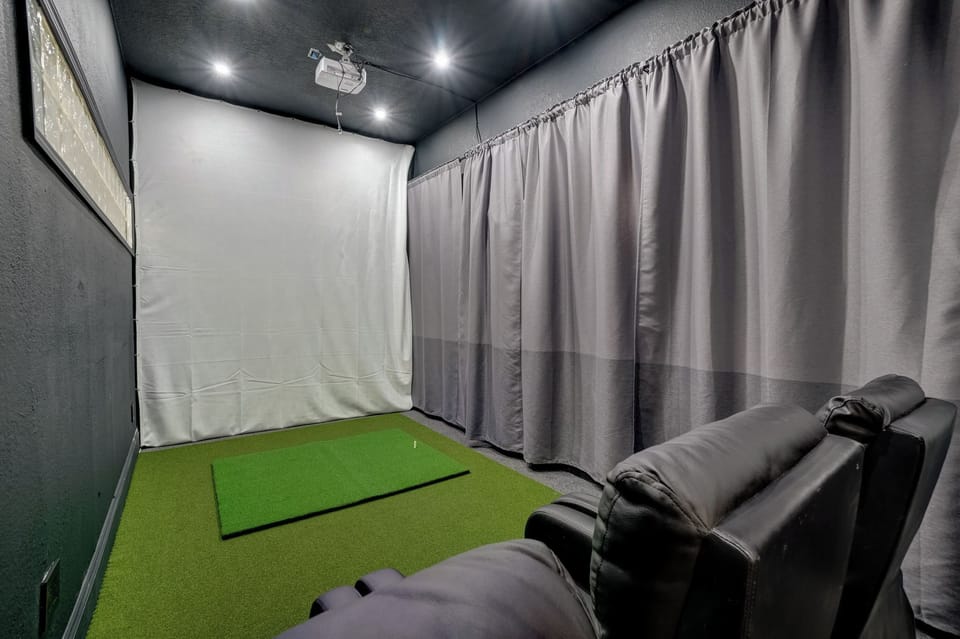 Home has a combined Golf Studio, Game & Movie room with some comfortable movie bean bag chairs to watch your favorite movie or game.