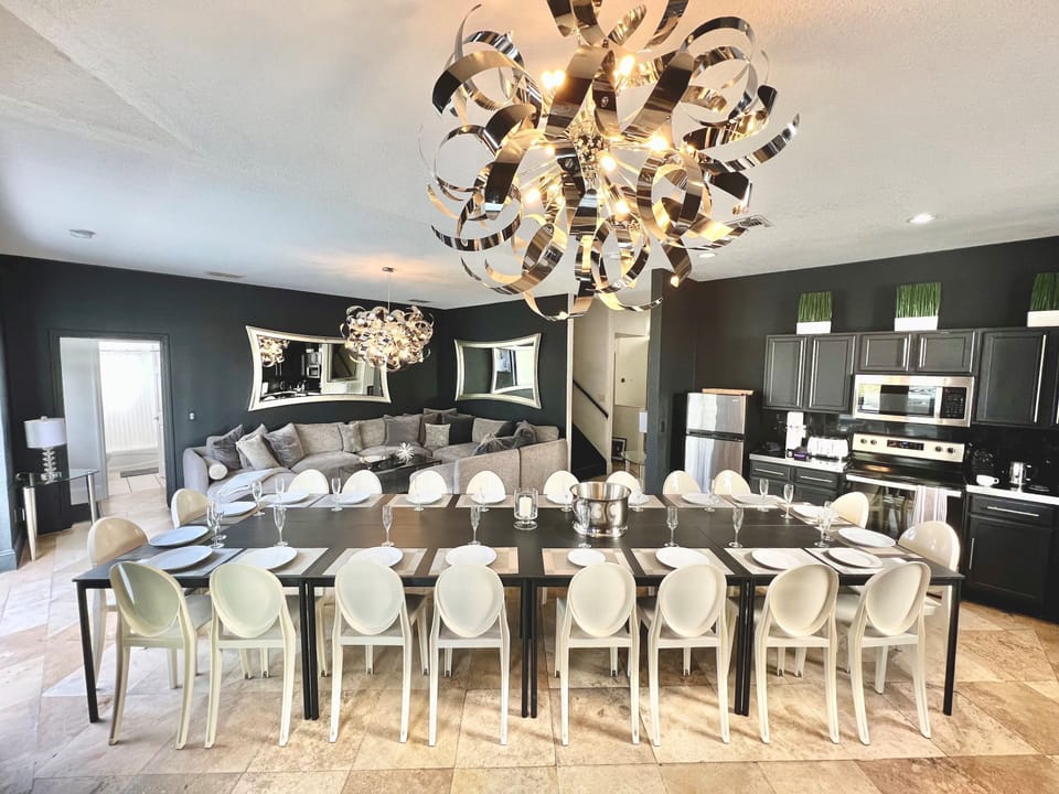 Private Dining Room with your entertaining private chef dinners with Philip Starck designed chairs for exclusive sit down dinners for up to 20 persons inside and 24 persons outside overlooking private pool & golf. Then sip on a cocktail by Fire Pit.