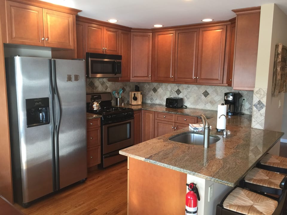 New kitchen is well equipped with nice china, glassware, appliances & gas stove