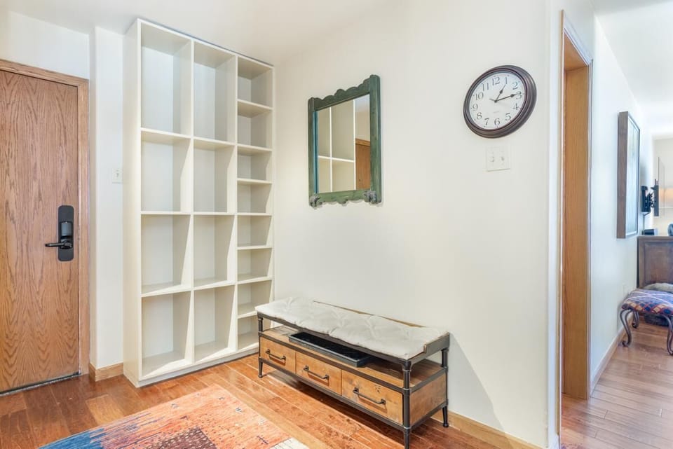Cozy entryway with stylish storage and warm lighting