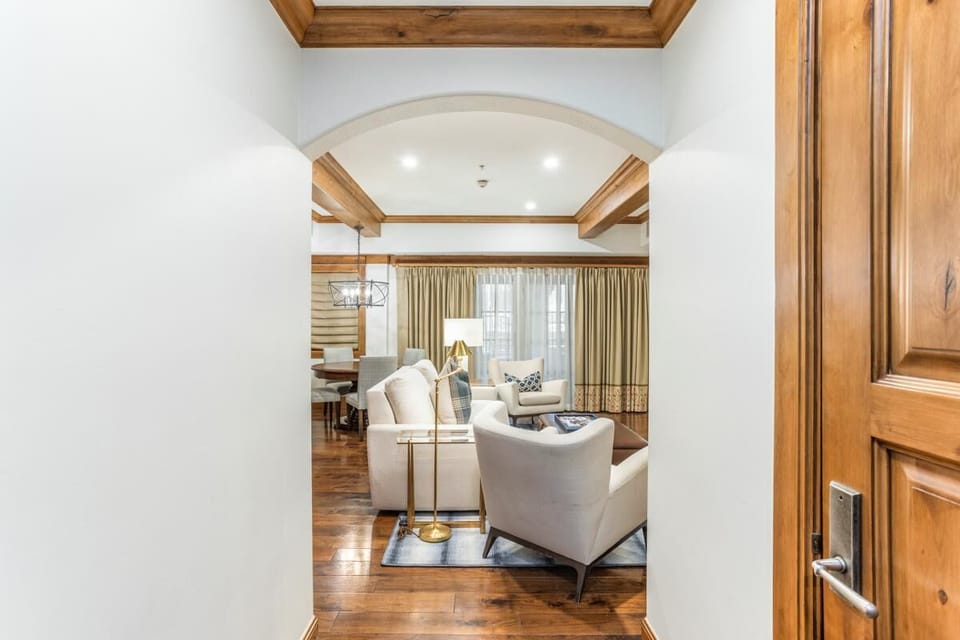 Welcoming living room with cozy seating and warm wood accents