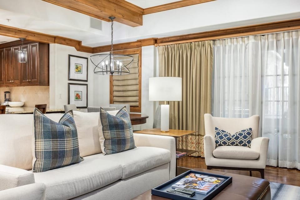 Cozy living room with rustic beams and warm lighting