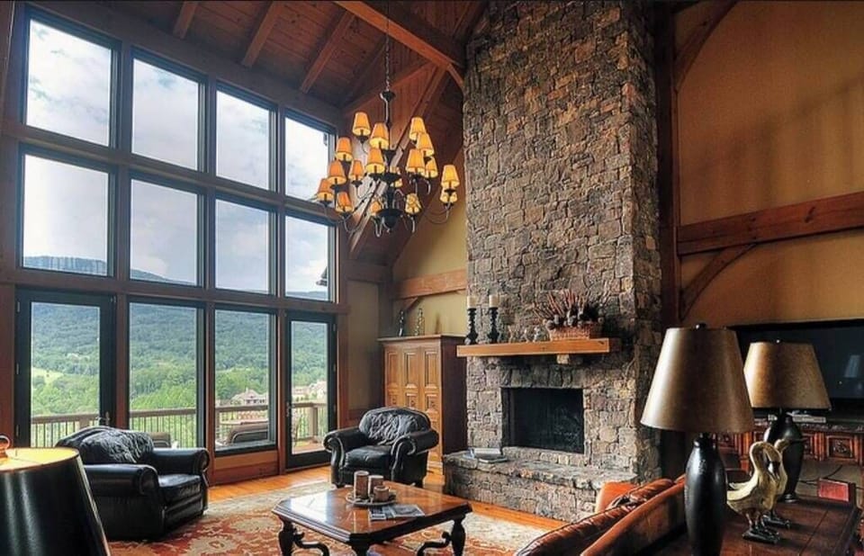 Fireplace with flick of the switch in living room, oversized windows to rear