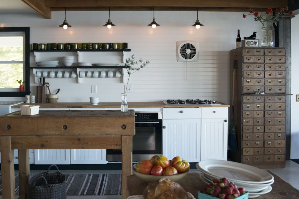 The kitchen has been fully renovated and has a toaster, blender and microwave