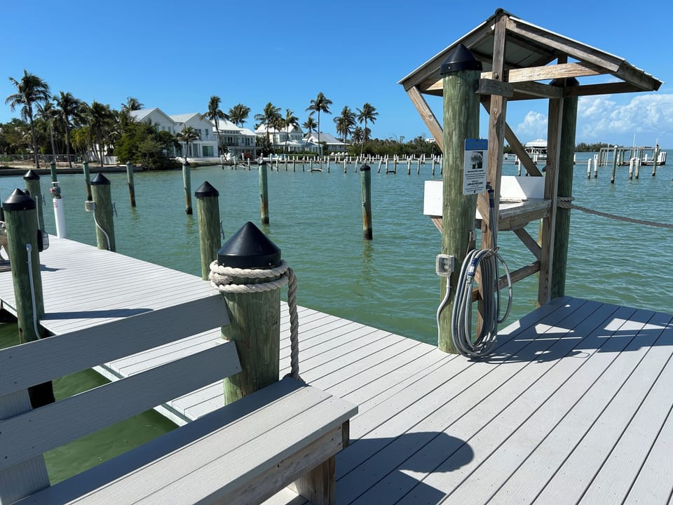 The private dock features a table to clean fish and a seating bench.