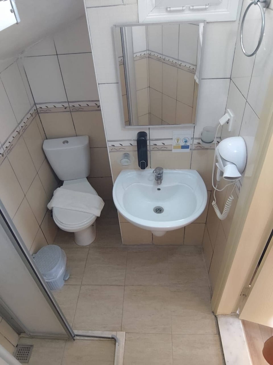 Shower, free toiletries, hair dryer, slippers