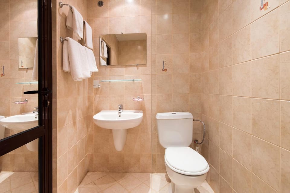 Shower, free toiletries, slippers