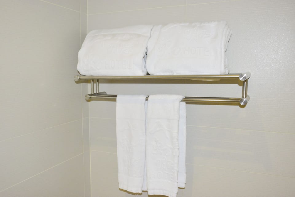 Shower, free toiletries, hair dryer, slippers