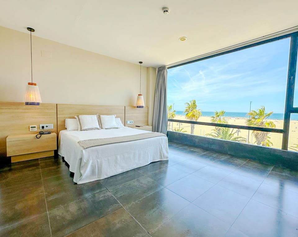 Suite, Sea View | Minibar, in-room safe, blackout drapes, iron/ironing board