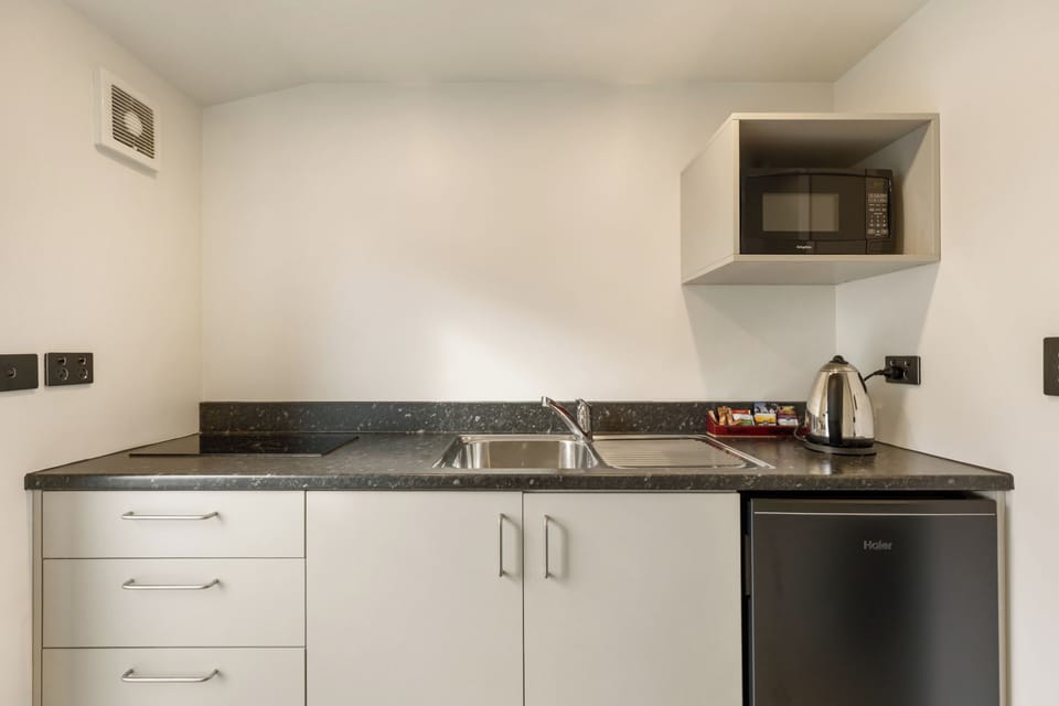 Mini-fridge, microwave, stovetop, electric kettle