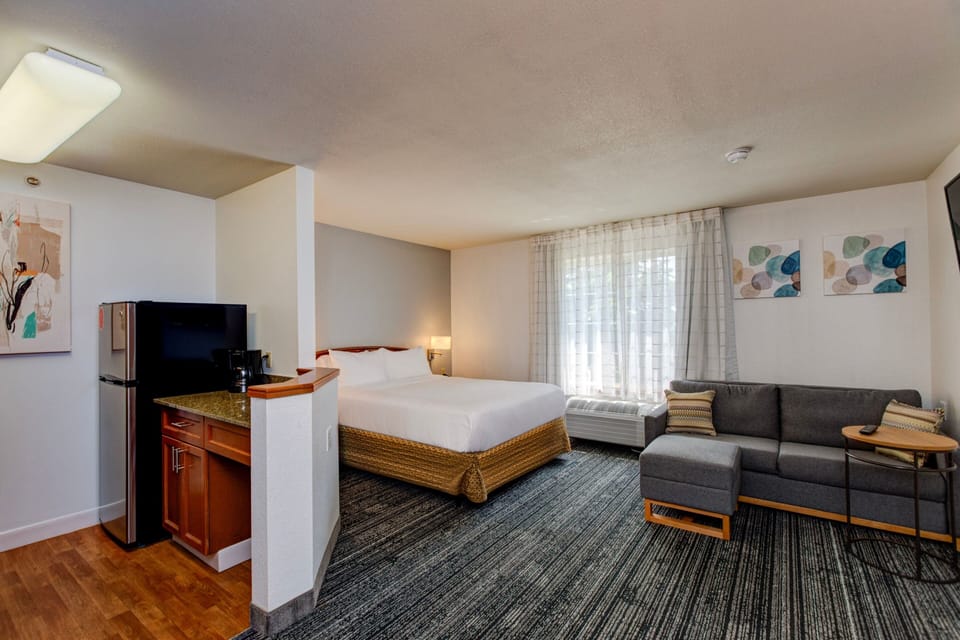 Premium bedding, desk, laptop workspace, iron/ironing board