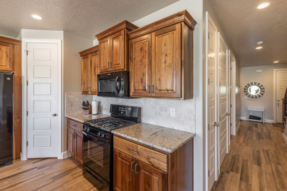 Kitchen Cabinets - Sleek kitchen cabinets stocked with everything you may need.