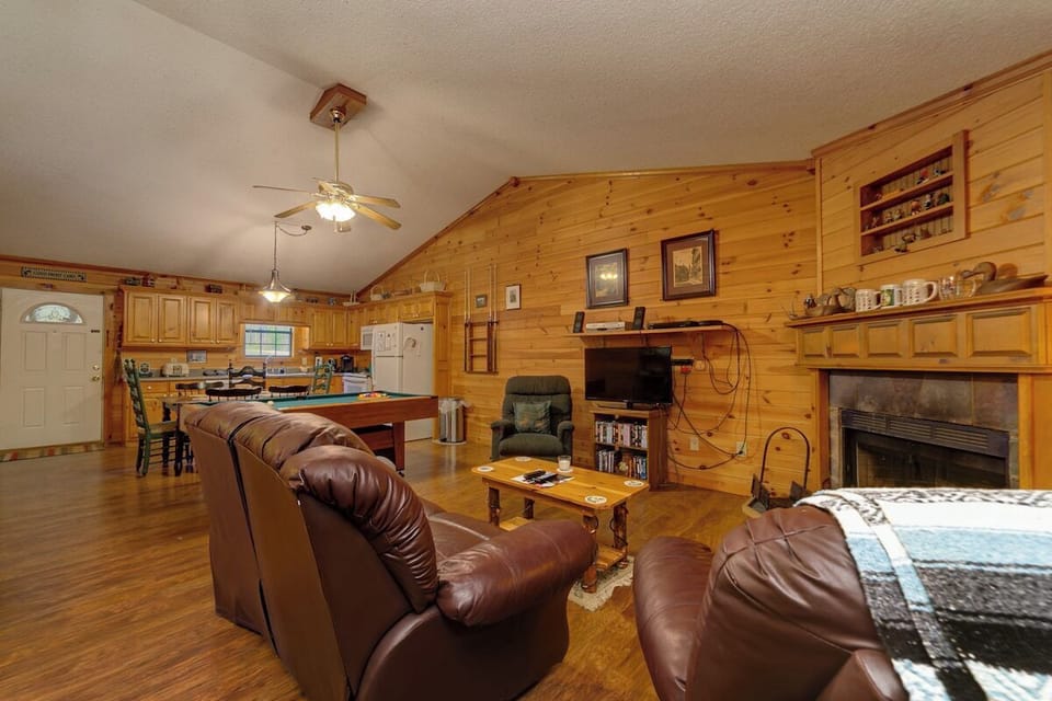 Living Room with Wood Fireplace and Pool Table