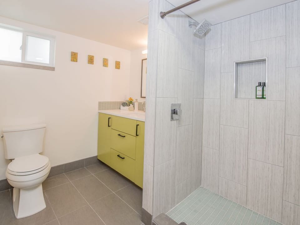 The 2nd full bath is in the lower level, with walk in shower and beautiful tile.