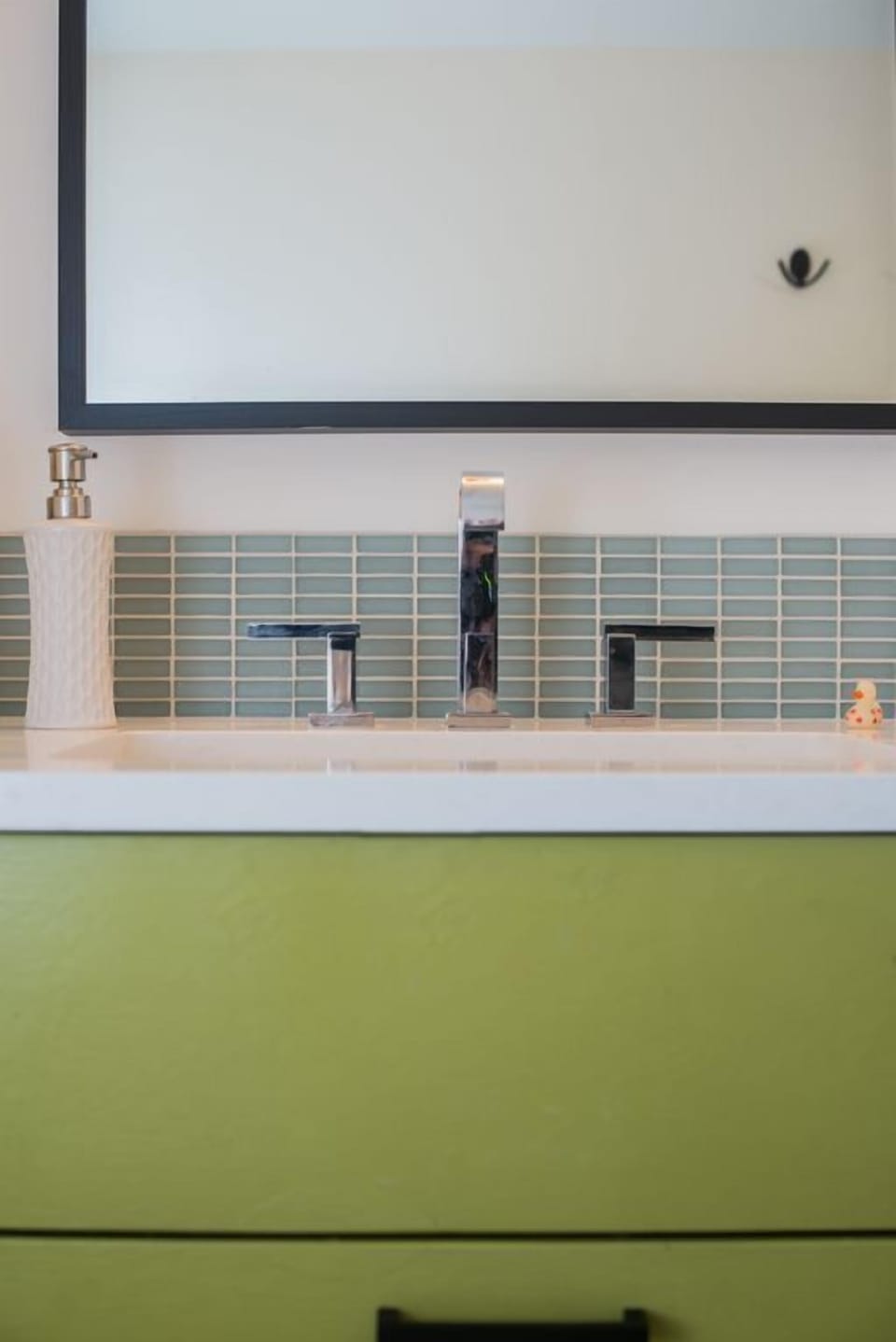 The shower has a double shower head, allowing for 2 people to shower together.